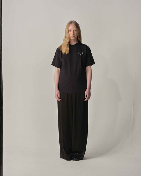 Teija xx 'Kiss and Wink' logo Tee in Black styled with lack trouser