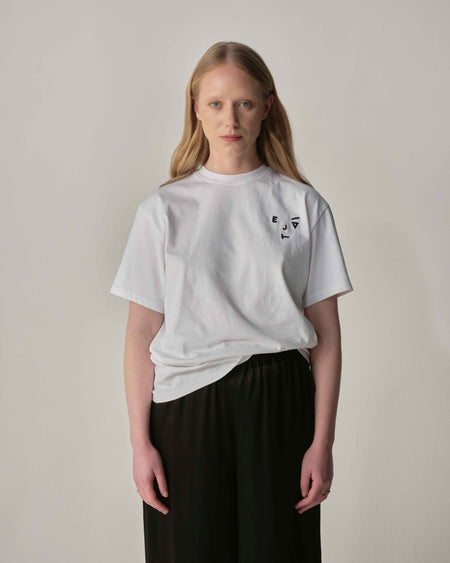 Unisex Tee with 'Kiss and Wink' logo in white