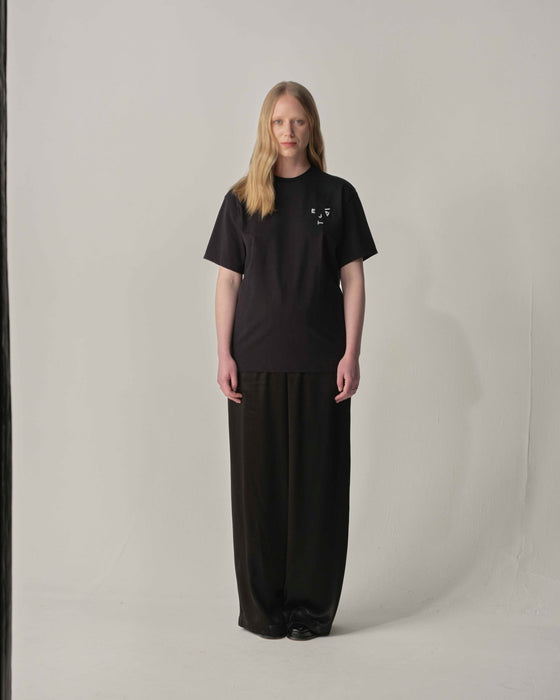 Teija xx 'Kiss and Wink' logo Tee in Black styled with lack trouser 