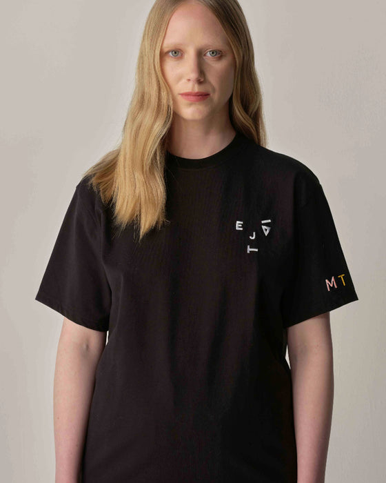 Monogram Unisex 'Kiss and Wink' Logo Tee in Black